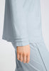 Close-up view of a women model wearing HA pastel sky cotton L/SLV Pajama