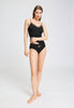 Full-body view of a women model wearing HA black cotton Midi Briefs
