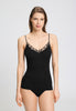 Front view of a women model wearing HA black cotton Spaghetti Top