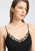 Close-up view of a women model wearing HA black cotton Spaghetti Top