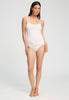 Full-body view of a women model wearing HA off white cotton Spaghetti Top