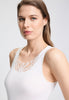 Close-up view of a women model wearing HA off white cotton Tank Top