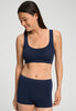 Front view of a women model wearing HA deep navy microfibre Crop Top
