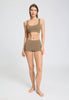 Full-body view of a women model wearing HA suede camel microfibre Crop Top
