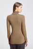Back view of a women model wearing HA suede camel modal/viscose/tencel Turtle-Neck Shirt