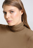 Close-up view of a women model wearing HA suede camel modal/viscose/tencel Turtle-Neck Shirt