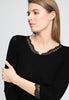 Close-up view of a women model wearing HA black wool 3/4 SLV Shirt