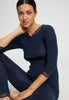 Close-up view of a women model wearing HA deep navy wool 3/4 SLV Shirt