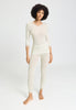 Full-body view of a women model wearing HA misty white wool 3/4 SLV Shirt