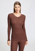 Front view of a women model wearing HA cinnamon wool L/SLV Shirt