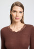 Close-up view of a women model wearing HA cinnamon wool L/SLV Shirt