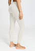 Back view of a women model wearing HA misty white wool Leggings