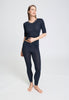 Full-body view of a women model wearing HA deep navy wool S/SLV Shirt