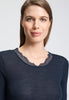 Close-up view of a women model wearing HA deep navy wool S/SLV Shirt