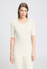 Front view of a women model wearing HA misty white wool S/SLV Shirt