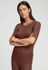 Front view of a women model wearing HA cinnamon wool S/SLV Shirt