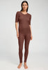 Full-body view of a women model wearing HA cinnamon wool S/SLV Shirt
