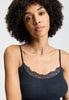Close-up view of a women model wearing HA deep navy wool Spaghetti Top