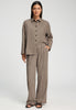 Full-body view of a women model wearing HA earthy woven cotton Long Pants