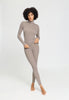 Full-body view of a women model wearing HA rose grey wool Leggings