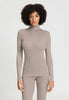Front view of a women model wearing HA rose grey wool Turtle-Neck Shirt