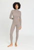 Full-body view of a women model wearing HA rose grey wool Turtle-Neck Shirt