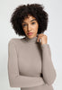 Close-up view of a women model wearing HA rose grey wool Turtle-Neck Shirt
